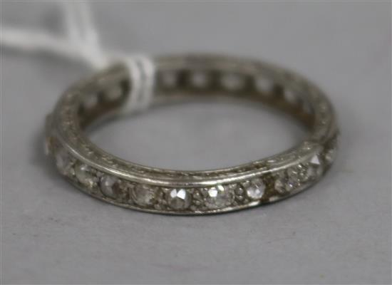 A white metal and diamond set full eternity ring, size S.